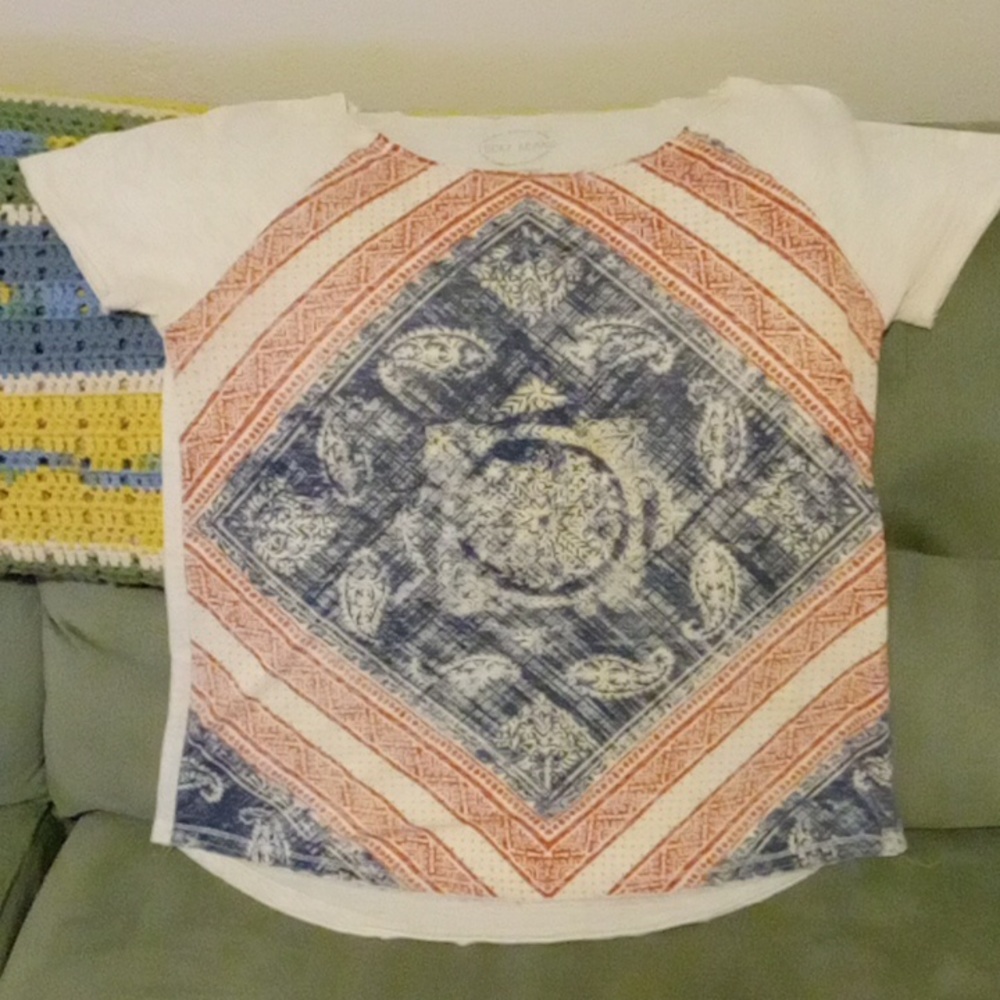 Medium creme, blue, and peach reddish accents on beige blouse